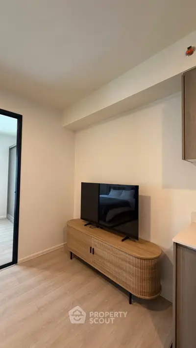 Modern living room with sleek TV stand and minimalist decor