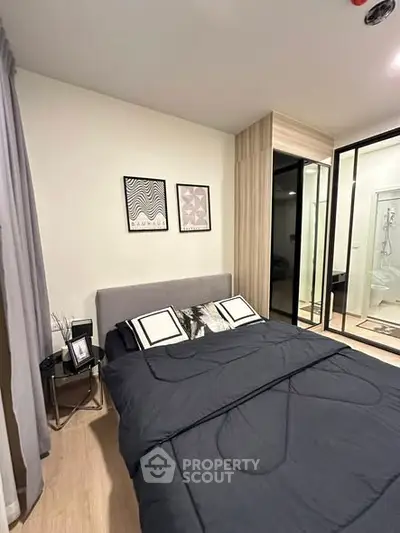 Modern bedroom with stylish decor and glass partition