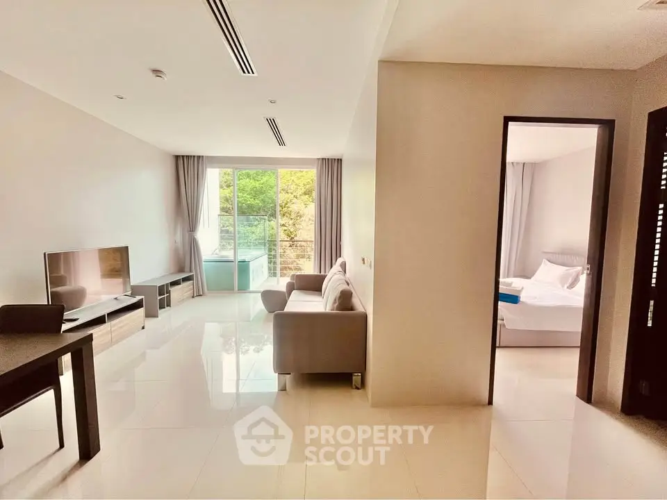 Spacious modern living room with open layout and balcony view