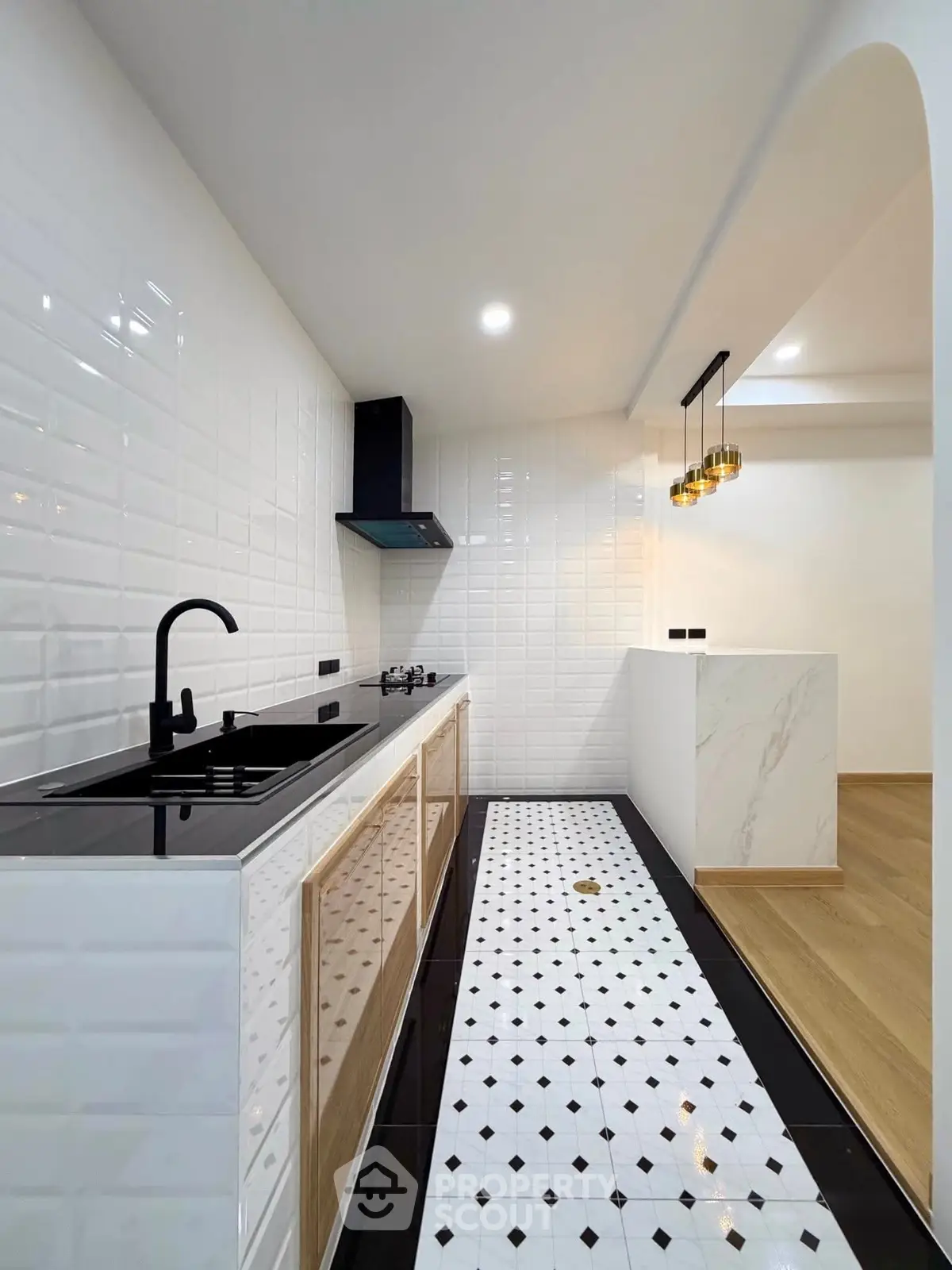 Modern kitchen with sleek black fixtures and stylish tile flooring