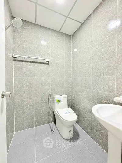 Modern bathroom with sleek gray tiles and contemporary fixtures