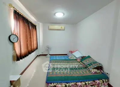 Cozy bedroom with air conditioning and natural light