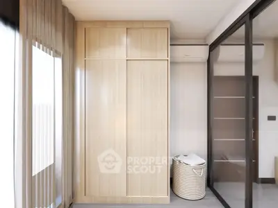 Modern bedroom with sleek wardrobe and glass sliding doors