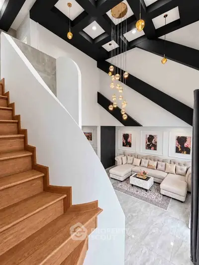 Luxurious modern living room with high ceilings and elegant staircase