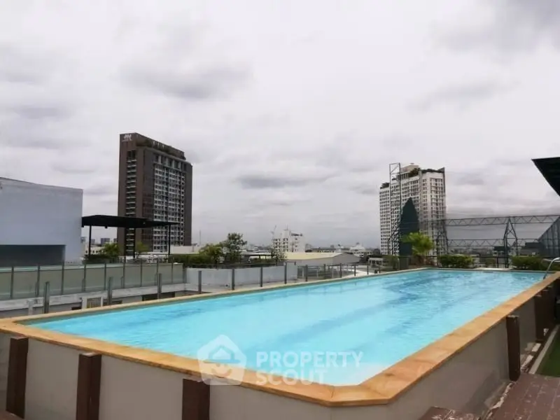 Stunning rooftop pool with city skyline views, perfect for relaxation and leisure.