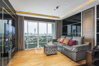 Luxurious living room with city view, modern decor, and spacious balcony access.