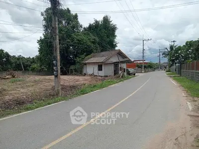 Charming rural property with potential for development, featuring a quaint house and expansive land.
