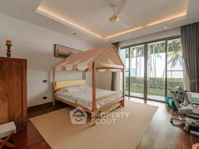 Charming bedroom with unique canopy bed and garden view, featuring elegant wooden flooring and modern decor.