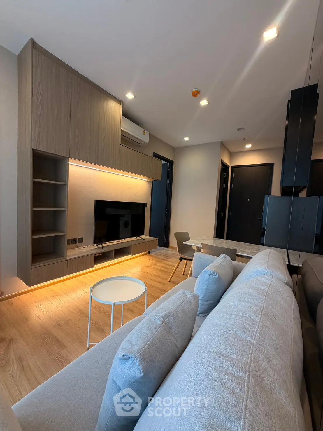Modern living room with stylish furniture and ambient lighting