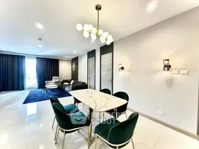 Luxurious modern dining area with elegant marble table and plush chairs in spacious living room.