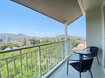 Spacious balcony with stunning mountain view, perfect for relaxation and enjoying nature.