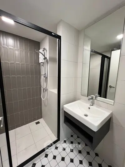 Modern bathroom with sleek shower and stylish sink design