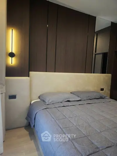 Luxurious modern bedroom with elegant lighting and plush bedding