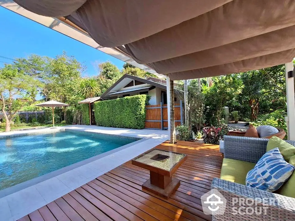 Stunning backyard with pool and cozy seating area, perfect for relaxation and entertainment.