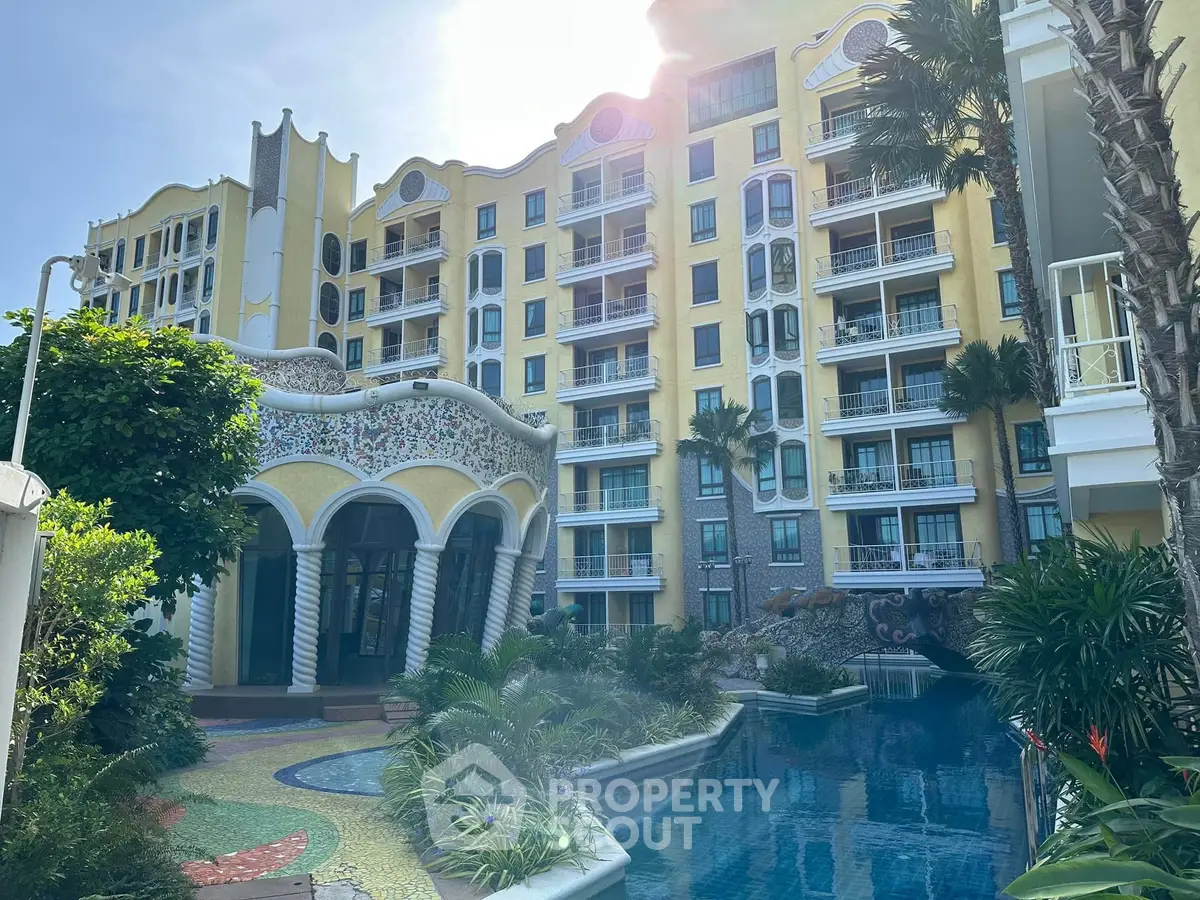 Luxurious resort-style building with pool and lush greenery, perfect for upscale living.