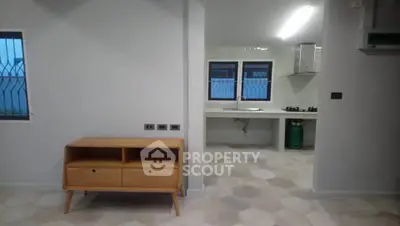 Modern open layout kitchen with sleek cabinetry and gas stove