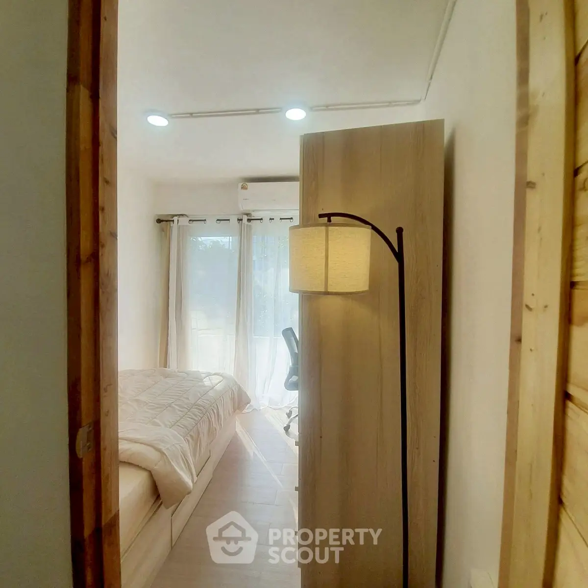 Cozy bedroom with natural light and modern decor