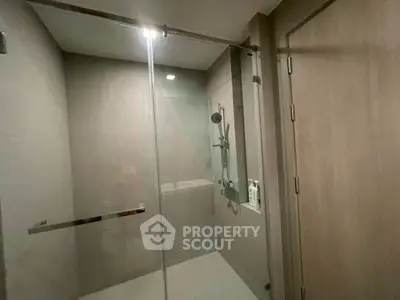 Modern bathroom with glass shower enclosure and sleek design