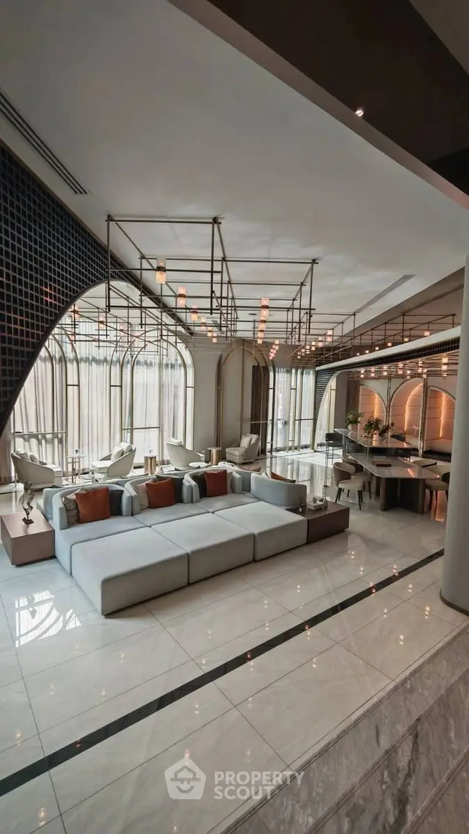 Luxurious modern living room with elegant design and spacious seating area, perfect for entertaining guests.