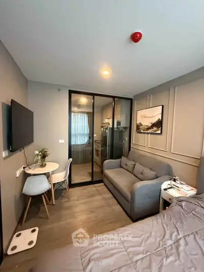 Modern studio apartment with cozy living area and stylish decor