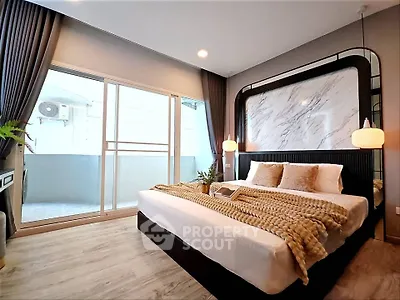 Luxurious bedroom with modern decor and balcony access