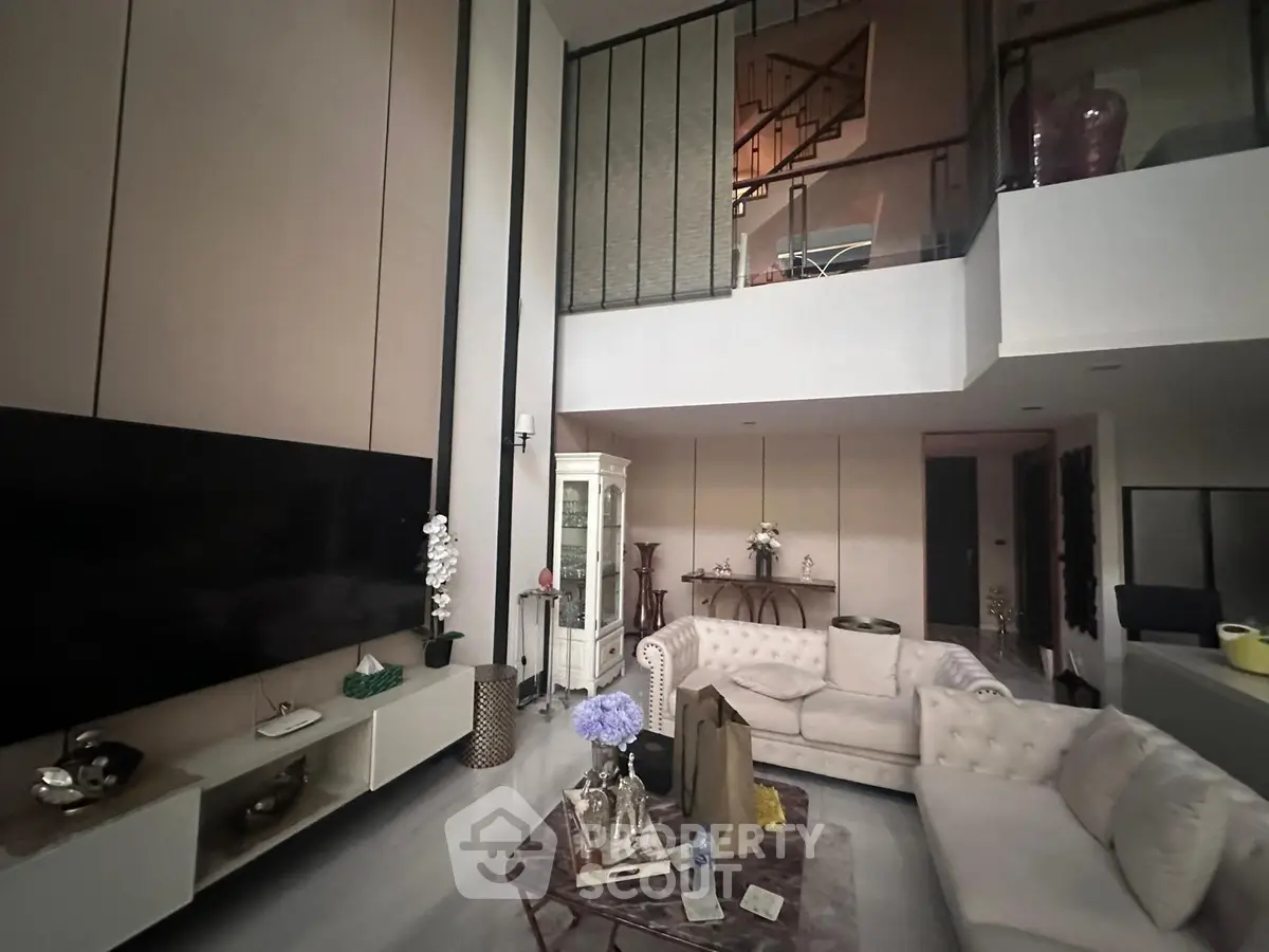 Luxurious modern living room with high ceilings and elegant decor