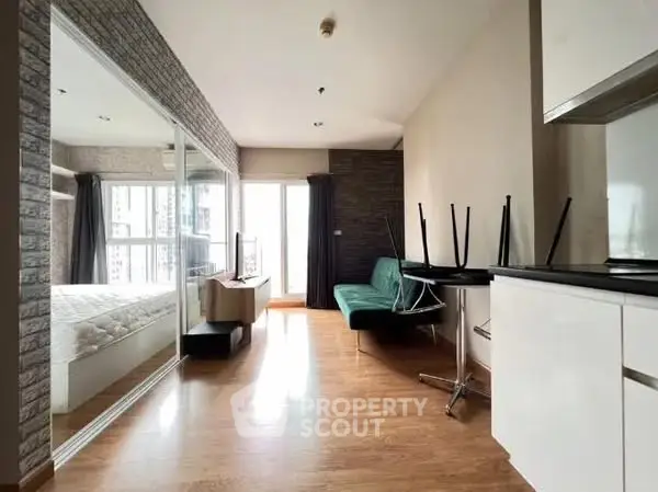 Modern apartment interior with wooden flooring and large windows