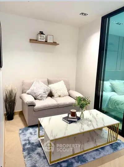 Cozy living room with modern decor and plush seating in a stylish apartment.