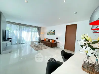 Spacious modern living room with sleek design and abundant natural light