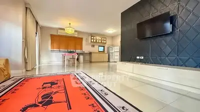 Spacious modern living room with open kitchen and stylish decor