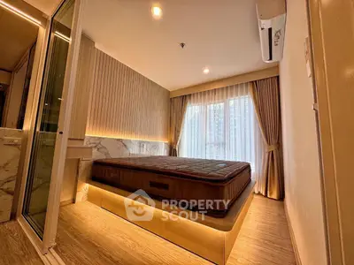 Luxurious bedroom with modern design and ambient lighting in a high-end apartment.