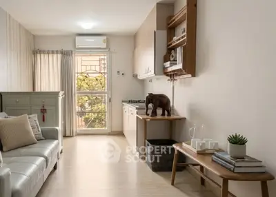 Stylish living room with modern decor and natural light in cozy apartment.