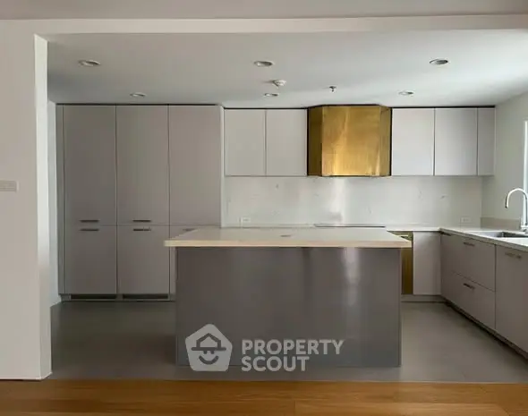 Modern kitchen with sleek cabinetry and island in minimalist design