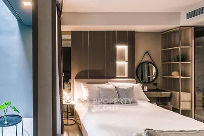 Luxurious modern bedroom with stylish decor and ambient lighting