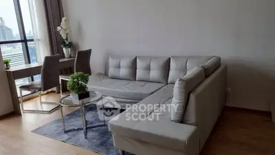 Modern living room with sleek furniture and city view, perfect for urban living.