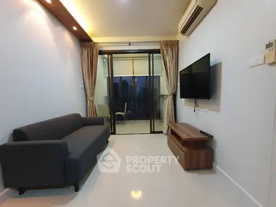 Modern living room with sleek furniture and balcony view in high-rise apartment.