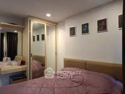 Cozy bedroom with mirrored closet and stylish decor