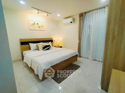 Modern bedroom with stylish decor and natural light