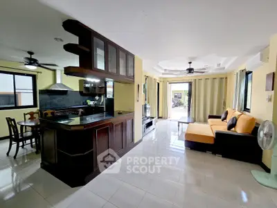 Spacious open-layout living room with modern kitchen and stylish furnishings