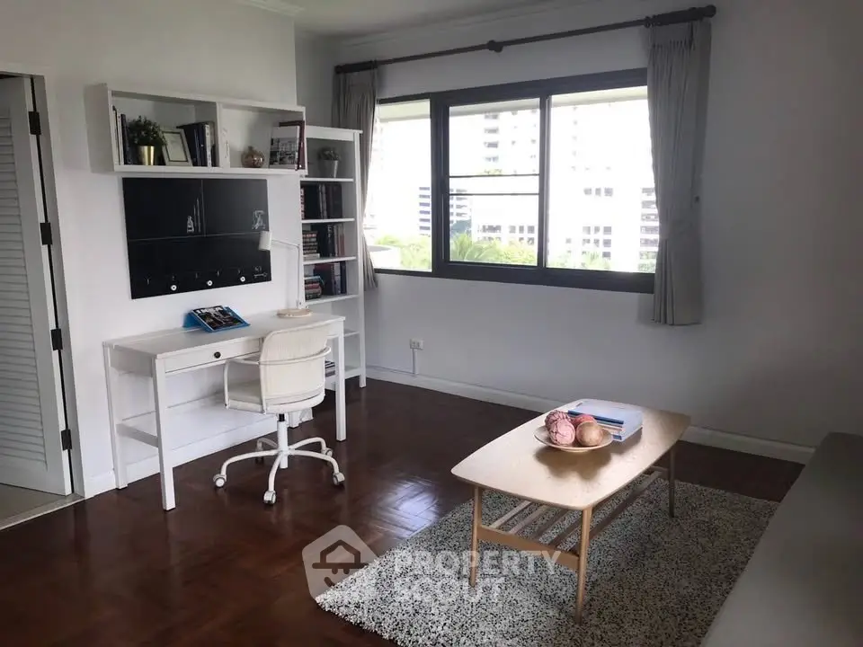 Bright study room with modern desk and large window view
