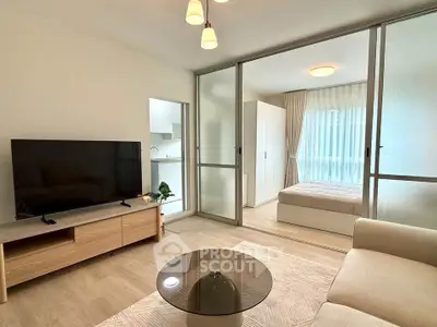 Modern living room with open layout and cozy bedroom view