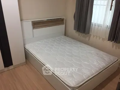 Cozy bedroom with modern bed and natural light