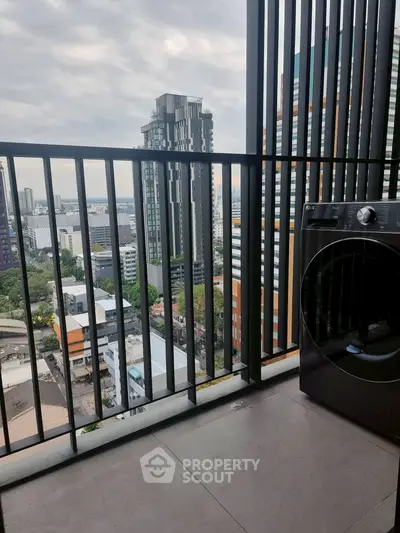 Modern balcony with city view and washing machine, perfect for urban living.