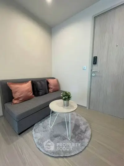 Cozy living room with modern sofa and stylish decor in a contemporary apartment.