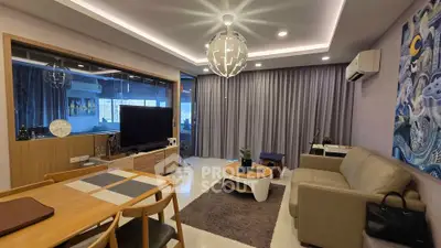 Modern living room with stylish decor, featuring a cozy sofa, elegant dining area, and contemporary lighting.
