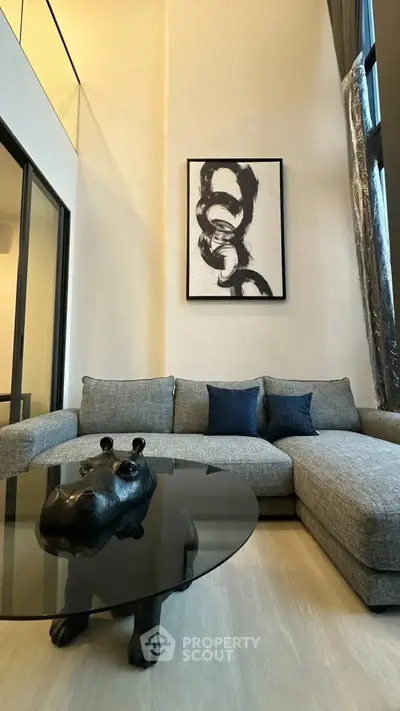 Modern living room with stylish gray sofa and unique hippo coffee table
