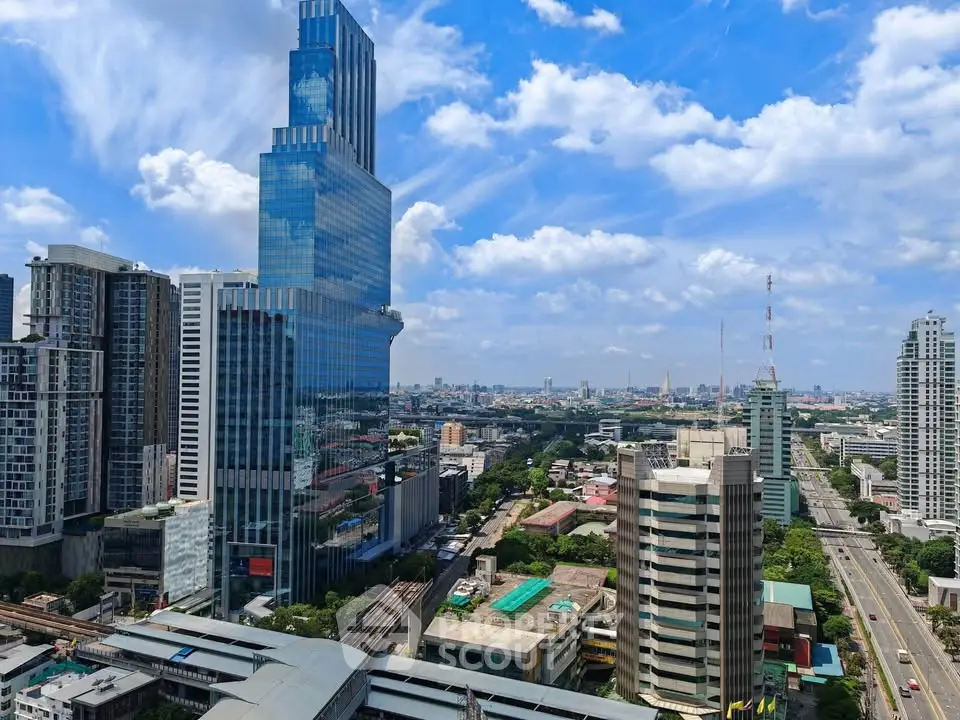 Stunning cityscape view showcasing modern skyscrapers and vibrant urban skyline under a clear blue sky.