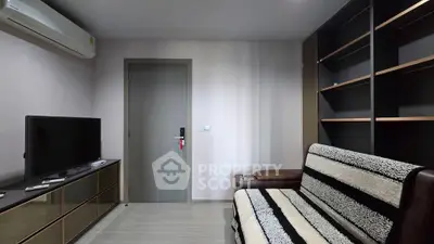 Modern living room with sleek furniture and built-in shelving, perfect for urban living.