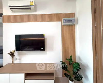 Modern living room with wall-mounted TV and stylish decor