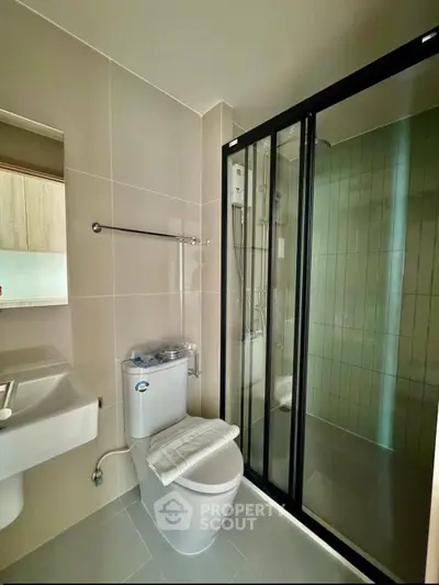 Modern bathroom with sleek shower enclosure and contemporary fixtures